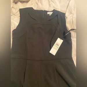 Black Calvin Klein Jumpsuit with Cutouts at Neckline and Pockets. NWT Size 8.